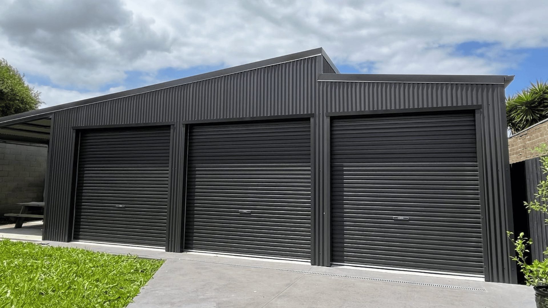 Triple black roller garage doors