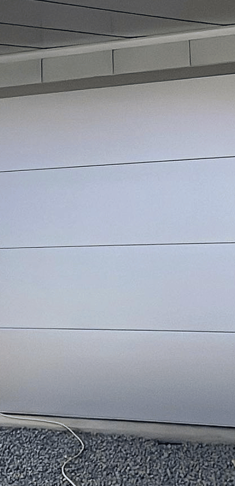 White sectional panel lift garage door