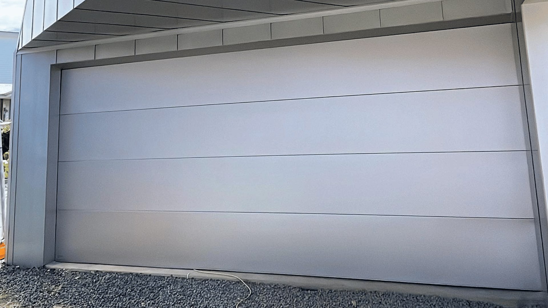 White sectional panel lift garage door